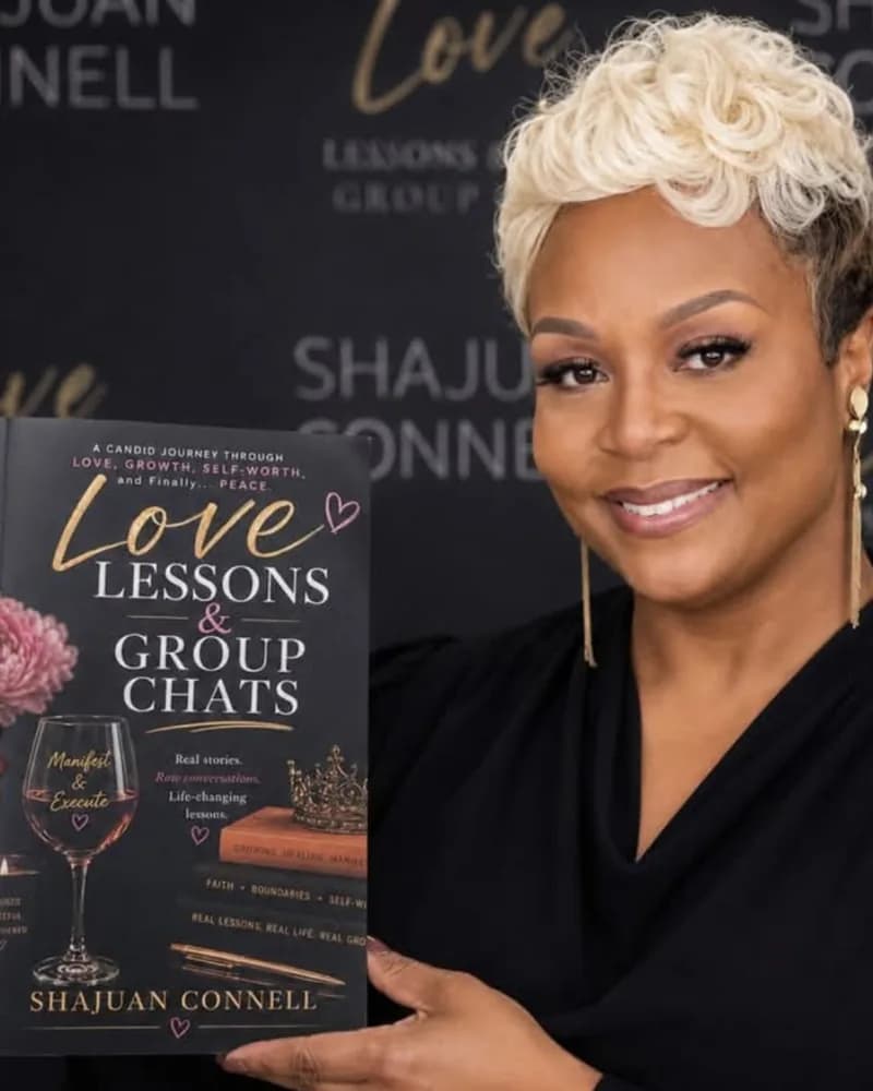 Shajuan Connell holding her book Love Lessons & Group Chats